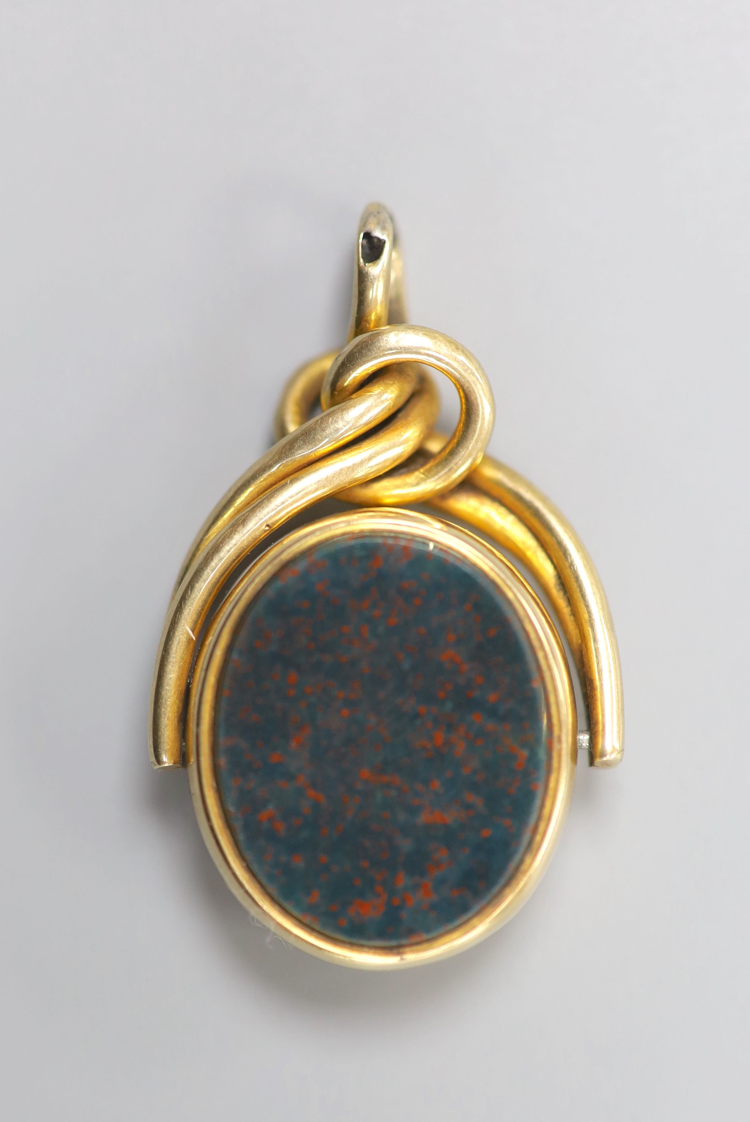 A yellow metal, bloodstone and sardonyx set swivelling fob seal